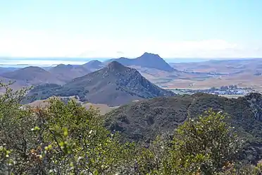 A view of several of the Nine Sisters towards Morro Rock from Bishop Peak