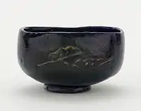 Tea bowl with designs of pine boughs and interlocking circles, unknown raku ware workshop, Kyoto, Edo period, 18th–19th century