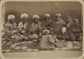 Troop of Tajik or Uzbek musicians from Russian Turkestan.  Musician on far left has pilili-like instrument.