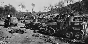 Type 92 Chiyoda armoured car and a Type 92 tankette entering a Chinese village; 1930s
