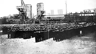 The King addressing the crews - HMS Warspite in background.jpg