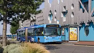A blue Baycar-branded bendybus in Cardiff